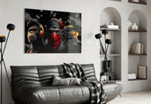 3 Wise Monkeys glass wall art styled above a desk in a study