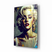 Marilyn Monroe glass wall art displayed above a walnut headboard in a serene bedroom with linen drapes and a brass lamp