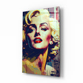 Marilyn Glamour glass wall art displayed above a velvet sofa in a moody living room with brass sconces