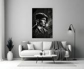 Thomas Shelby close-up showing newsboy cap silhouette with curling smoke