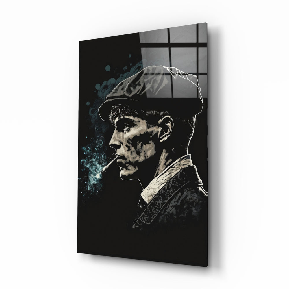 Thomas Shelby glass wall art displayed above a leather chesterfield in a moody man cave with brass sconces