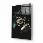 Thomas Shelby glass wall art displayed above a leather chesterfield in a moody man cave with brass sconces