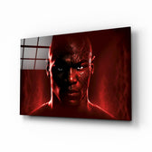 Iconic Michael Jordan glass wall art displayed above a leather sofa in a moody man cave with brass sconces