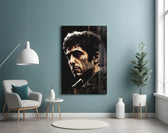 Al Pacino glass wall art styled above a leather chesterfield in a library