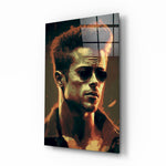 Tyler Durden glass wall art displayed above a leather sofa in a moody man cave with brass sconces