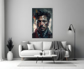 The Iron close-up showing Tony Stark with crimson splatters and sulfur paint