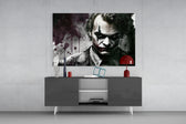 Joker panel catching lamp light to reveal its noir gravity