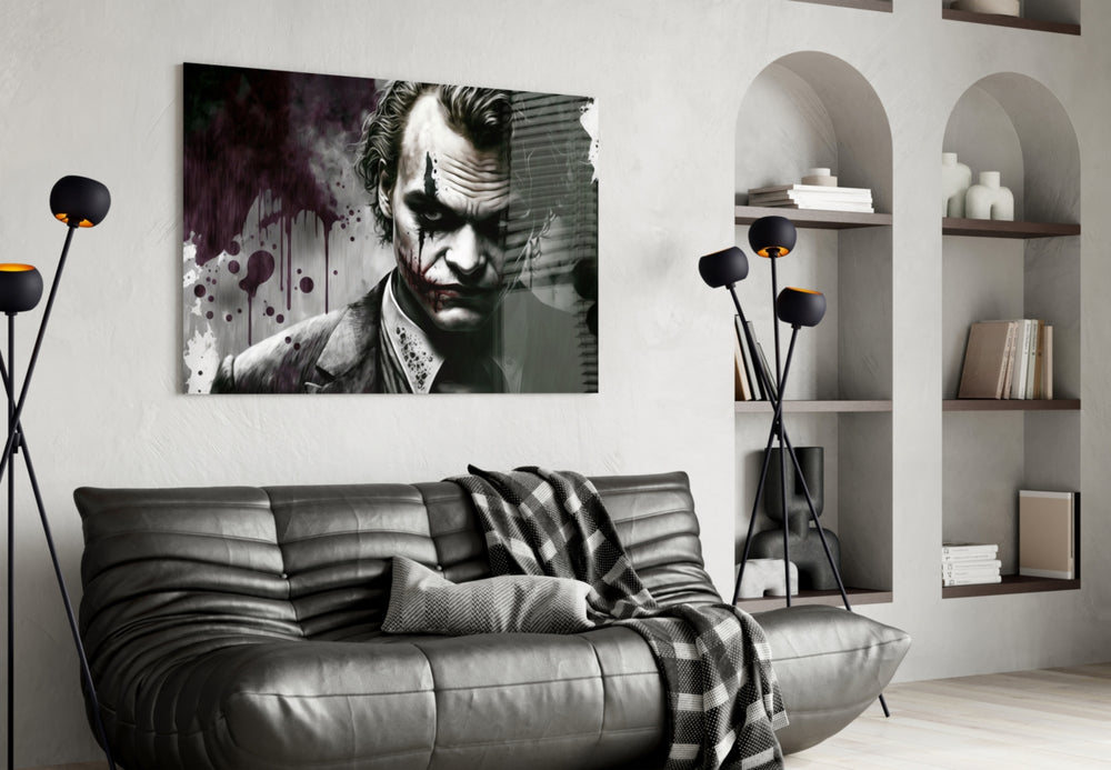 Joker glass wall art styled above a console in a study