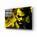Joker glass wall art displayed above a leather sofa in a contemporary man cave with brass sconces