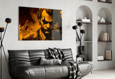 Joker glass wall art styled above a console in a study