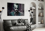 Joker glass wall art styled above a console in a study