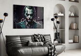 Joker glass wall art styled above a console in a study