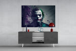 Joker panel catching lamp light to reveal its noir gravity
