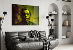 Joker glass wall art styled above a console in a study