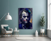 Joker glass wall art styled above a console in a study