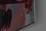 Joker artwork anchoring a wall with warm dramatic palette