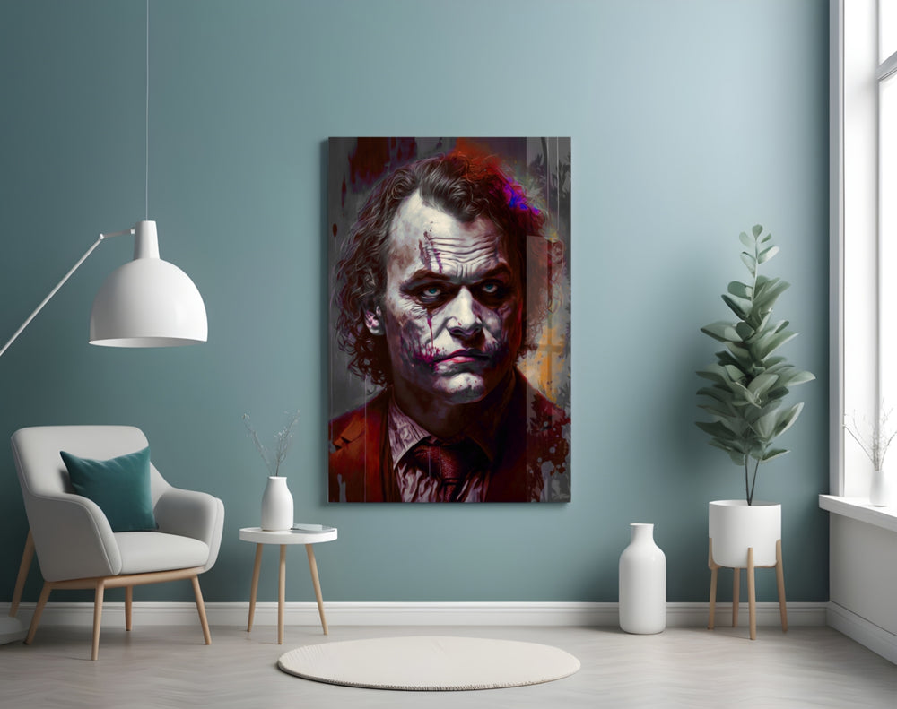 Joker glass wall art styled above a console in a study