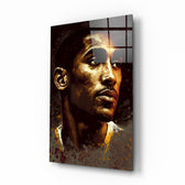 Kobe Bryant glass wall art displayed above a leather sofa in a moody man cave with brass sconces