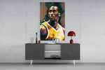 Kobe Bryant panel catching lamp light to reveal its team-pride gravity