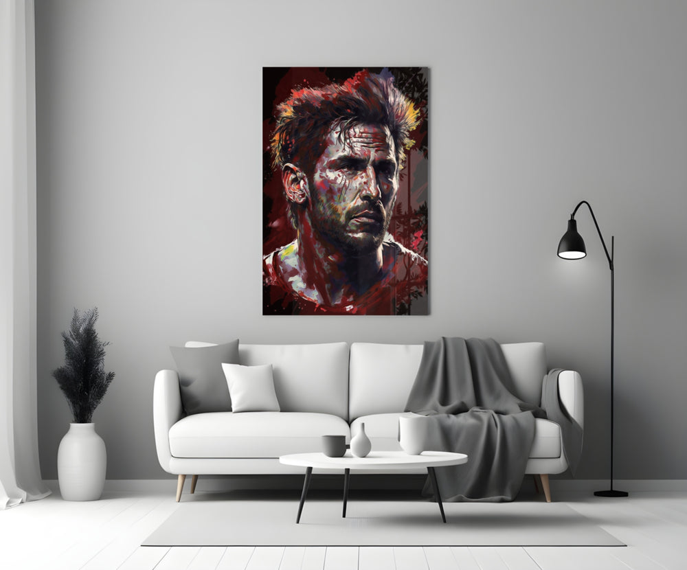 Messi close-up showing red and ochre splatter across forehead and beard