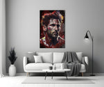 Messi close-up showing red and ochre splatter across forehead and beard