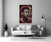 Messi close-up showing red and ochre splatter across forehead and beard