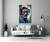 Dali close-up showing red and teal splatter across cheek and shoulder