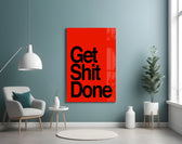 Get Shit Done glass wall art styled above a console in a startup lounge