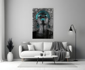 Women close-up showing teal braided headwrap, teal lips and teardrop earrings