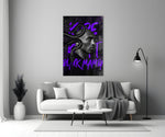 Kobe close-up showing black mamba coiled around bald crown on snake-scale wall