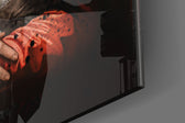 Renaissance artwork anchoring a wall with crimson-and-onyx palette