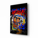 Basquiat-style glass wall art displayed above a workbench in a creative studio