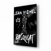 Basquiat-style glass wall art displayed above a workbench in a creative studio