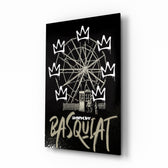 Banksy Basquiat glass wall art displayed above a workbench in a creative studio