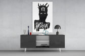 Basquiat-style panel catching lamp light to reveal its painterly stillness