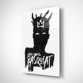 Basquiat-style glass wall art displayed above a workbench in a creative studio