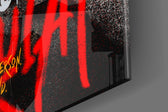 Real-photo artwork anchoring a wall with scarlet-and-onyx palette