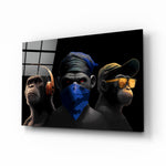 3 Wise Monkeys glass wall art displayed above a leather sofa in a man cave with collector pulse