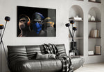 3 Wise Monkeys glass wall art styled above a console in a study