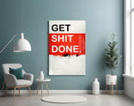 Get Shit Done glass wall art styled above a console in a startup lounge