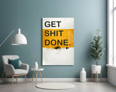 Get Shit Done glass wall art styled above a console in a creative studio