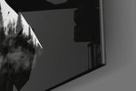 Inner-landscape artwork anchoring a wall with greyscale-and-cloud palette
