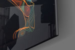 Tribal-faceted artwork anchoring a wall with onyx-and-saffron palette