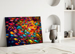 Fish World close-up showing scarlet, cobalt and emerald fish around amber whirlpool