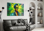 Rihanna glass wall art styled above a velvet bench in a salon