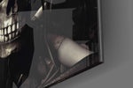 Skeletal-muse artwork anchoring a wall with ivory-and-graphite palette