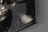 Skeletal-muse artwork anchoring a wall with ivory-and-graphite palette