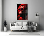 Ape the Thinker close-up showing red wayfarer sunglasses and scarlet rim light