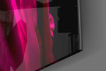 Runway-muse artwork anchoring a wall with magenta-and-cyan palette
