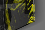 Hooded-muse artwork anchoring a wall with canary-and-graphite palette